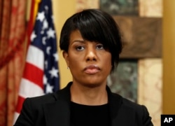 FILE - Mayor Stephanie Rawlings-Blake prepares to speak to the media at City Hall in Baltimore, May 1, 2015.