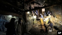 Visitors look at display at Sado Kinzan Gold Mine historic site in Sado, Niigata prefecture, Japan, Nov. 23, 2024.