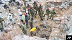 FILE — Zambian Army special forces officers follow the rescue operation of miners in Chingola, Dec. 3, 2023 