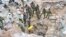 FILE — Zambian Army special forces officers follow the rescue operation of miners in Chingola, Dec. 3, 2023 