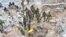 FILE - Zambian Army special forces officers follow the rescue operation of miners on Sunday, Dec. 3, 2023 in Chingola, around 400 kilometres (248 miles) north of the capital Lusaka, Zambia. 