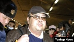 Kim Jong-Nam, aéroport international de Pékin, Chine, février 2007. 