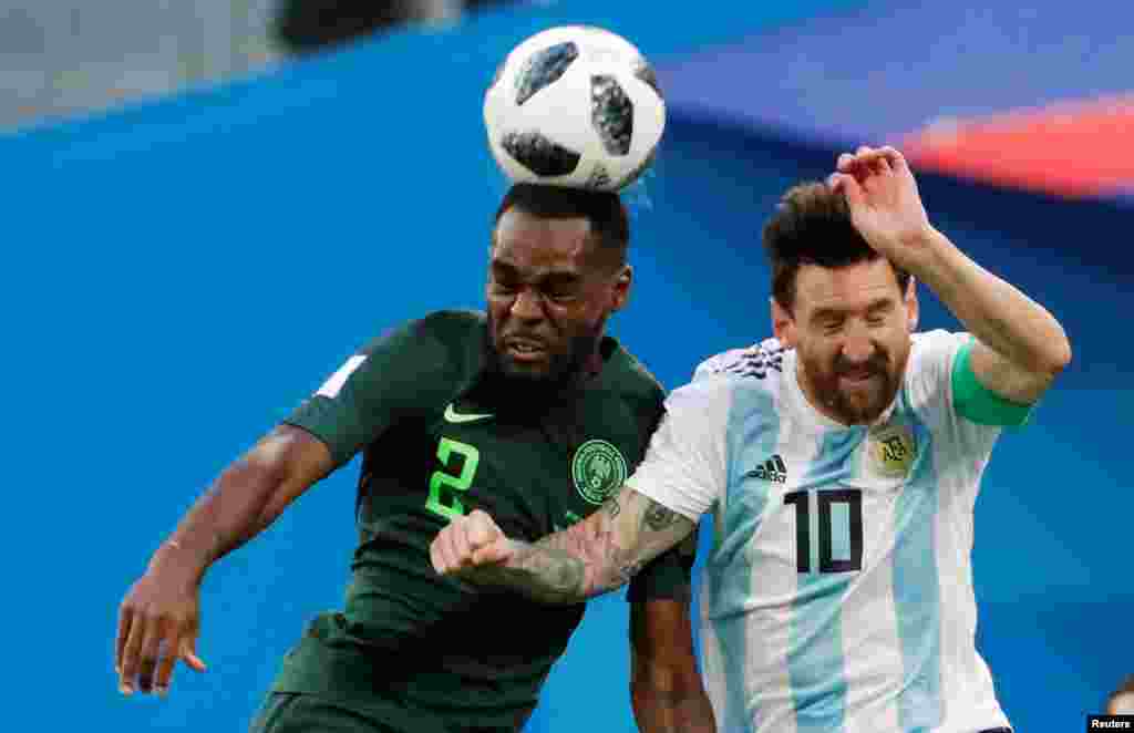 Brian Idowu of Nigeria (left) and Argentina's Lionel Messi fight for the ball during the group D match between Argentina and Nigeria, during the 2018 soccer World Cup at the St. Petersburg Stadium.