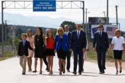 FILE - Then-U.S. Vice President Joe Biden and his family members walk along the national road named after his late son, Joseph R. "Beau" Biden III, in the village of Sojevo, Kosovo, Aug. 17, 2016.