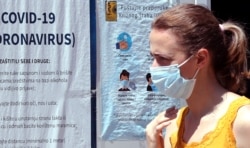 A woman arrives at the hospital to test for coronavirus in Sarajevo, Bosnia and Herzegovina, 01 July 2020.