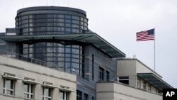 FILE - A U.S. flag sits atop the U.S. Embassy in Berlin, Jan. 3, 2022. President Donald Trump on Feb. 12, 2025, directed the secretary of state to revamp the U.S. Foreign Service to ensure implementation of the president's foreign policy agenda.