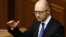 Ukraine's Prime Minister Arseny Yatseniuk speaks to deputies as he presents a work plan of his government during a parliament session in Kyiv, Dec. 11, 2014. 