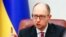 FILE - Ukraine's Prime Minister Arseny Yatseniuk speaks during a government meeting in Kyiv, Dec. 3, 2014. 