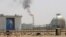 FILE - A gas flame is seen in the desert near the Khurais oilfield, about 160 km (99 miles) from Riyadh, Saudi Arabia, June 23, 2008.