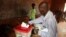 FILE - A man casts his ballot during elections in Bangui, Central African Republic, Dec. 30, 2015.