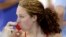 FILE - U.S. swimmer Shannon Vreeland uses an inhaler during a practice session ahead of the 2012 Summer Olympics, in London, July 26, 2012.