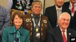 U.S. Secretary of State Rex Tillerson (seated right) and U.S. Sen. Lisa Murkowski pose with Nulato Chief Mickey Stickman at an Arctic Council event in Fairbanks, Alaska. 