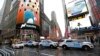 A row of New York City police cars is parked along a street in Times Square, Dec. 29, 2016, in New York.