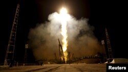 The Soyuz TMA-16M spacecraft carrying the International Space Station crew of Mikhail Kornienko and Gennady Padalka of Russia and Scott Kelly of the U.S. blasts off at the Baikonur cosmodrome, March 28, 2015.