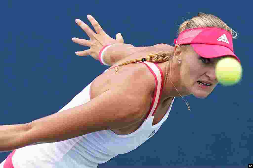 Kristina Mladenovic of France returns a shot to Varvara Gracheva of Russia during the second round of the U.S. Open tennis championships in New York.