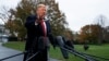 President Donald Trump talks with reporters before departing for France on the South Lawn of the White House, Friday, Nov. 9, 20