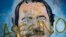 ARCHIVO - Un mural del presidente de Nicaragua, Daniel Ortega, con inscripciones en su contra como parte de las protestas contra su gobierno y que piden su renuncia en Managua, Nicaragua, en mayo de 2018. 