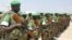 Part of the 3 battalion of the Uganda People's Defence Force prepare to leave for African Union peace keeping in Magadishu, Somalia, Friday Sept. 4. 2009, in Entebbe, Uganda. Uganda has sent another group of soldiers to Somalia for a peace keeping mission
