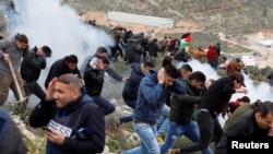 Des manifestants palestiniens dans le village de Beita, en Cisjordanie, le 15 fevrier 2018 