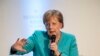 FILE - German Chancellor Angela Merkel takes part in a discussion during an event marking the 60th anniversary of the "Hessische Kreis" association in Frankfurt am Main, Germany, June 5, 2019.