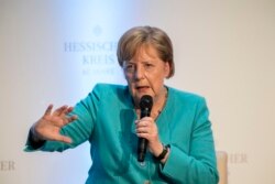 FILE - German Chancellor Angela Merkel takes part in a discussion during an event marking the 60th anniversary of the "Hessische Kreis" association in Frankfurt am Main, Germany, Wednesday June 5, 2019.