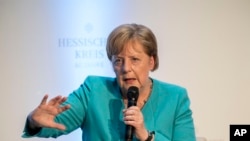 German Chancellor Angela Merkel takes part in a discussion during an event marking the 60th anniversary of the "Hessische Kreis" association in Frankfurt am Main, Germany, Wednesday June 5, 2019. (Thomas Lohnes/Pool via AP)