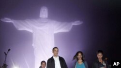 President Barack Obama with first lady Michelle Obama and daughters Malia and Sasha, left, tour the Christ the Redeemer Statue in Rio de Janeiro, Sunday, March 20, 2011. (AP Photo/Pablo Martinez Monsivais)