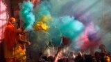 Hindu priests throws colored powder at the devotees during Holi celebrations at Bankey Bihari temple in Vrindavan, in the northern Indian state of Uttar Pradesh. Holi, also known as the Festival of Colors, heralds the beginning of spring and is celebrated all over India.
