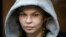 Anastasia Vashukevich, also known on social media as Nastya Rybka, sits in a cage in the court room in Moscow, Russia, Jan. 19, 2019.