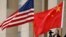 FILE - U.S. and Chinese flags fly at the Pentagon in Arlington, Virginia, November 9, 2018.