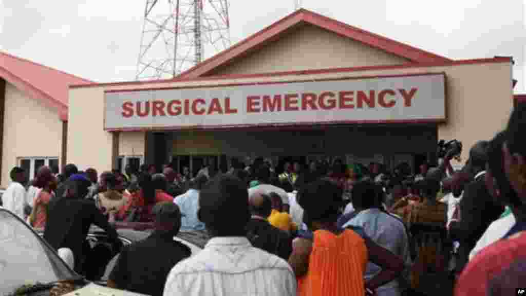 Family members and friends gather at the entrance of the hospital where survivals of a plane crash receive treatment.