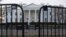 FILE - The White House is seen behind security barriers in Washington, March 24, 2019.