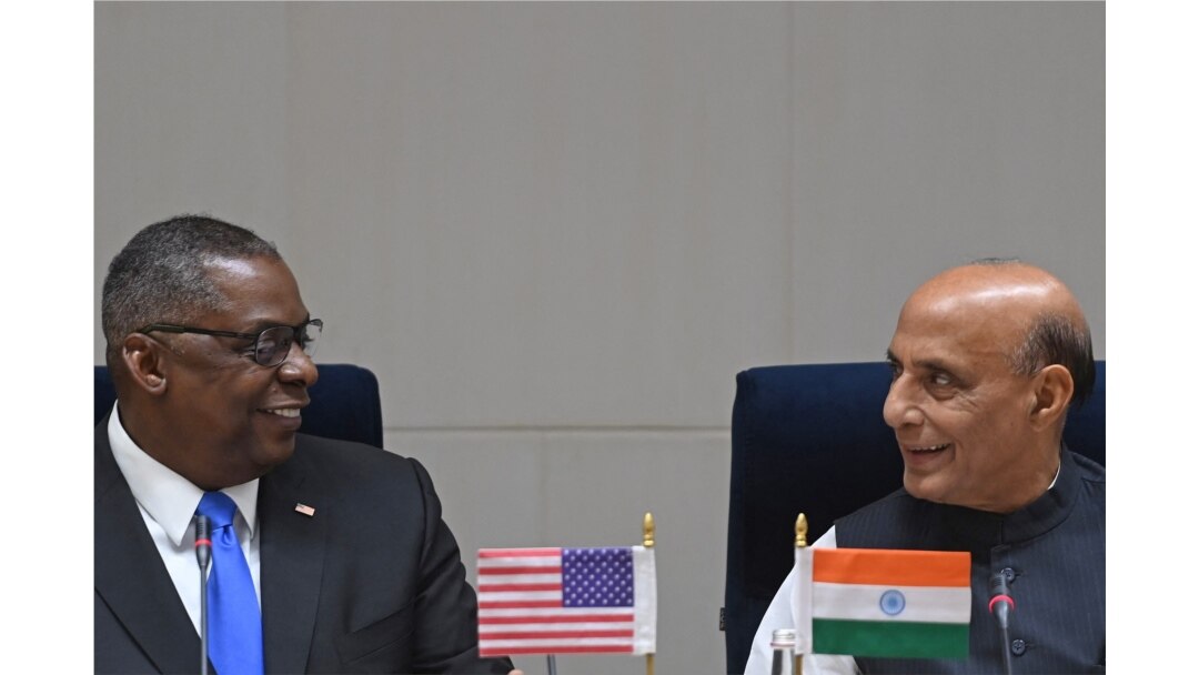 Visiting U.S. Defense Secretary Lloyd Austin (L) interacts with Indian Defense Minister Rajnath Singh during a joint media briefing in New Delhi, March 20, 2021.