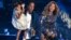 Jay-Z presents the Video Vanguard Award to Beyonce as he holds their daughter Blue Ivy during the 2014 MTV Video Music Awards in Inglewood, California Aug. 24, 2014.