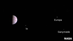 Juno's first image capture of Jupiter and some of its moons on July 5. (Credit: NASA)