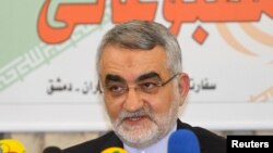 FILE - Alaeddin Boroujerdi, head of the Iranian parliamentary committee for national security and foreign policy, speaks during a news conference at the Iranian Embassy in Damascus Feb. 26, 2014, after his meeting with Syria's President Bashar al-Assad.