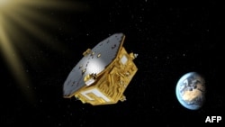 This handout image obtained from the European Space Agency on Nov. 29, 2015, shows an artist’s impression of the LISA Pathfinder, designed to test technology for future gravitational-wave observatories in space.