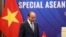 FILE - Vietnamese Prime Minister Nguyen Xuan Phuc walks to his desk ahead of the Special ASEAN summit on COVID-19 in Hanoi, Vietnam, April 14, 2020. 