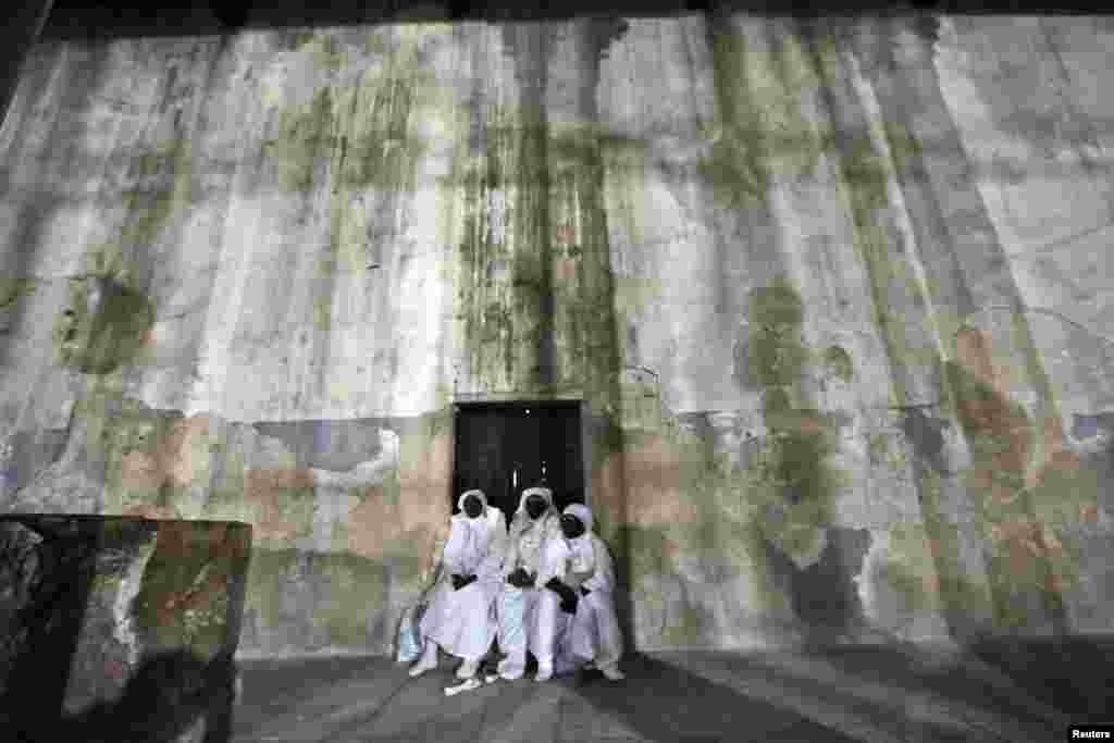 Nigerian pilgrims wait inside the Church of the Nativity, the site revered as the birthplace of Jesus, during Christmas celebrations in the West Bank town of Bethlehem.