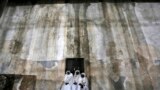 Nigerian pilgrims wait inside the Church of the Nativity, the site revered as the birthplace of Jesus, during Christmas celebrations in the West Bank town of Bethlehem.