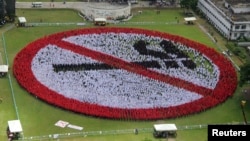 An aerial shot shows tens of thousands of Filipinos form a human no-smoking sign at the Bicol University football field in Legazpi city, Albay province, south of Manila, June 28, 2013. 