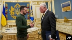 U.S. Special Envoy for Ukraine and Russia Keith Kellogg, right, and Ukrainian President Volodymyr Zelenskyy talk during their meeting in Kyiv on Feb. 20, 2025.