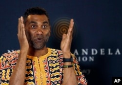 Kumi Naidoo, Secretary General of Amnesty International, gestures while speaking during a news conference at the Nelson Mandela Foundation in Johannesburg, South Africa, Aug. 16, 2018.