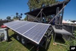 Solar panels are seen powering the How Stage during the Bonnaroo Music and Arts Festival on Saturday, June 18, 2022, in Manchester, Tenn. (Photo by Amy Harris/Invision/AP)
