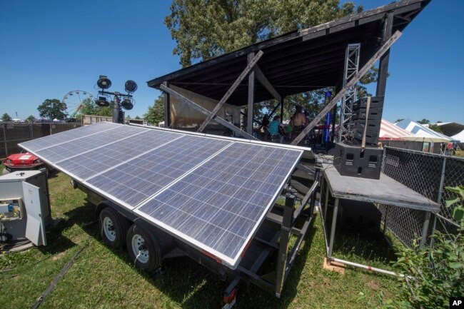 Solar panels are seen powering the How Stage during the Bonnaroo Music and Arts Festival on Saturday, June 18, 2022, in Manchester, Tenn. (Photo by Amy Harris/Invision/AP)