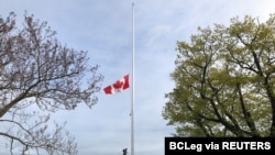Canada's national flag flies at half-mast at the British Columbia Legislature in Victoria, after the remains of 215 children were discovered in a mass grave at the former Kamloops Indian Residential School site, May 30, 2021.
