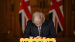 Britain's Prime Minister Boris Johnson reacts while leading a virtual press conference on the Covid-19 pandemic, inside 10 Downing Street in central London Tuesday Jan. 26, 2021. Official data shows that more than 100,000 people have died after…
