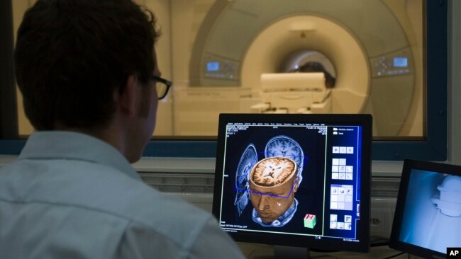 Sebastian Rieger, physicist MRI, makes a demonstration of the new 3 Tesla MRI (Magnetic Resonance Imaging) at the Brain and Behaviour Laboratory in Geneva, Switzerland, Dec. 8, 2008. (AP Photo/KEYSTONE/Salvatore Di Nolfi)