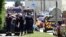 French police and firefighters gather at the entrance of the U.S.-based Air Products company in Saint-Quentin-Fallavier, near Lyon, central eastern France, June 26, 2015.  
