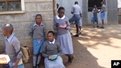 Pupils at Mariakani Primary School in Nairobi, Kenya, enjoy their lunchbreak, July 27, 2015.